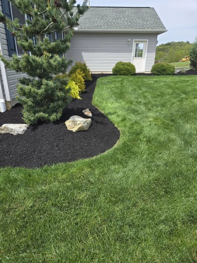 Professional landscape installation for homes in Williamsport, PA by Rinker Lawns
