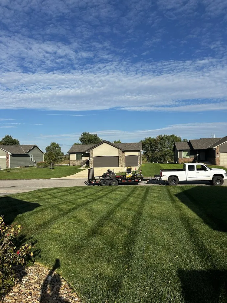 Local yard maintenance with custom design in Wichita, KS by Rising Lawn Care