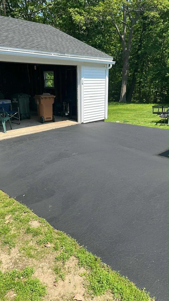 Professional lawn care service for residential properties in Portland, ME by Rivard Sealcoating