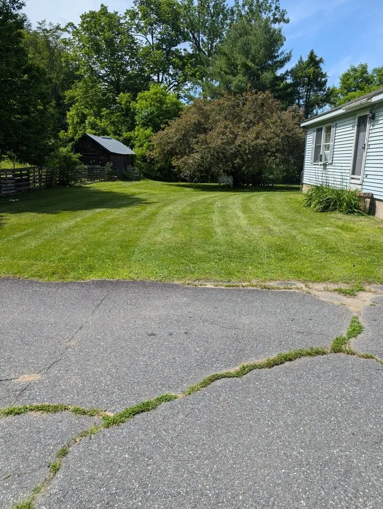 Expert lawn mowing service for year-round maintenance in White River Junction, VT by RL Property Service