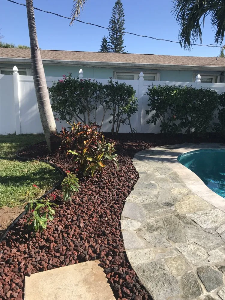 Professional garden landscaping for year-round maintenance in Melbourne Village, FL by RLA Professional Touch Landscaping