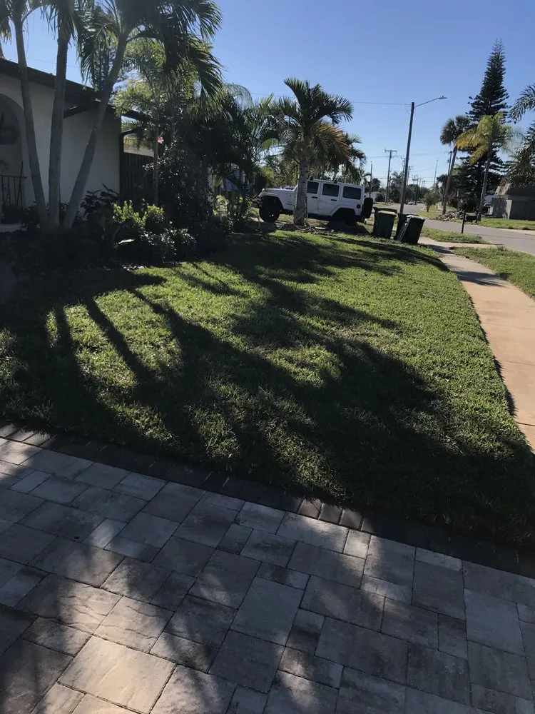 Professional yard cleanup service with custom design in Melbourne Village, FL by RLA Professional Touch Landscaping