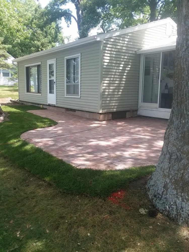 Custom lawn care service for year-round maintenance in Buffalo, MN by Rob's Lawn Care