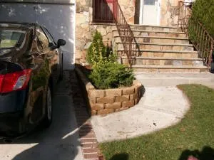 Professional outdoor landscaping with custom design in Staten Island, NY by Rocco's Landscaping and Concrete Service