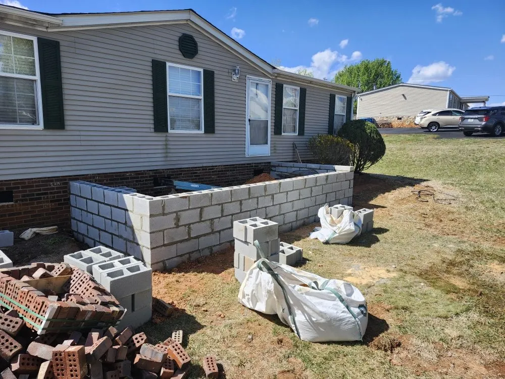 Reliable lawn mowing service in Lincolnton, NC by Rock & Timber Backyard Creations