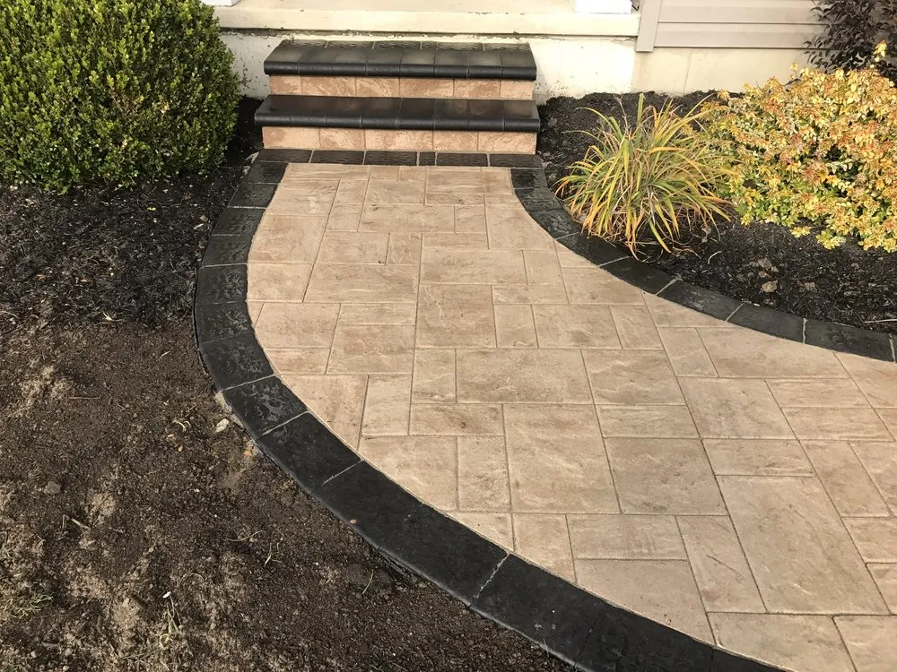 Professional yard maintenance for residential properties in Newark, DE by Rock Diamond Paving