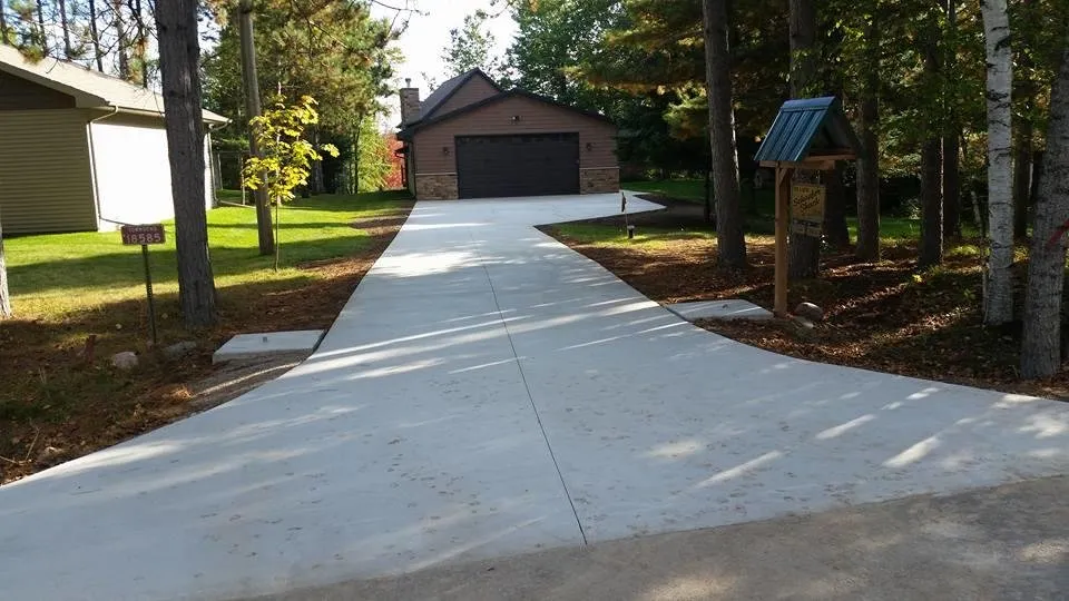 Top-rated lawn mowing service for year-round maintenance in Antigo, WI by Rock Hard Concrete