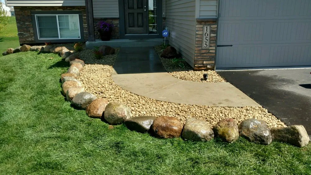 Custom outdoor landscaping with custom design in Loretto, MN by Rockman Landscaping & Tree Service