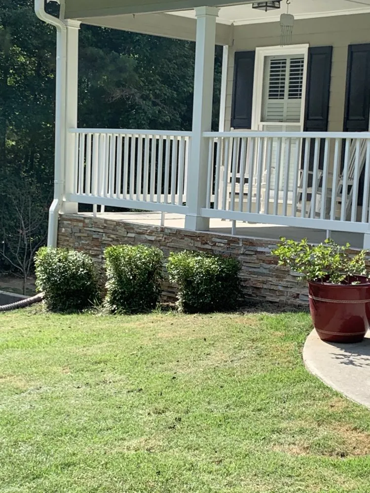 Custom landscape installation with custom design in Covington, GA by Rockstar Lawn Care