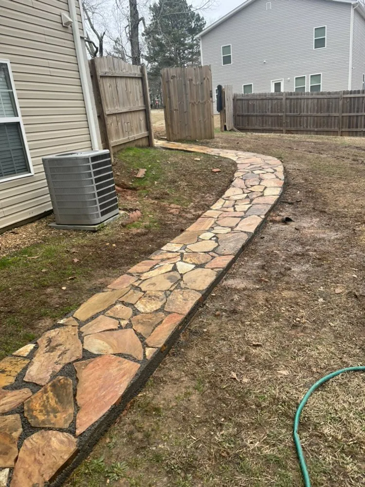 Custom outdoor landscaping with custom design in Carrollton, GA by Rodriguez Landscaping and Tree Work