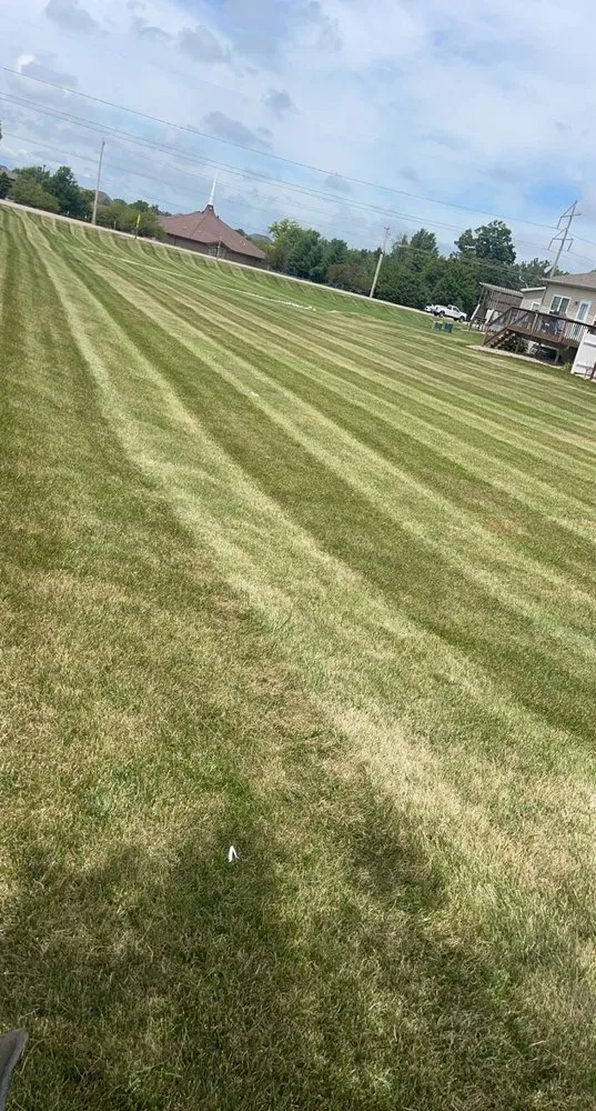 Reliable lawn mowing service with custom design in Hudson, IL by Roeske Mowing