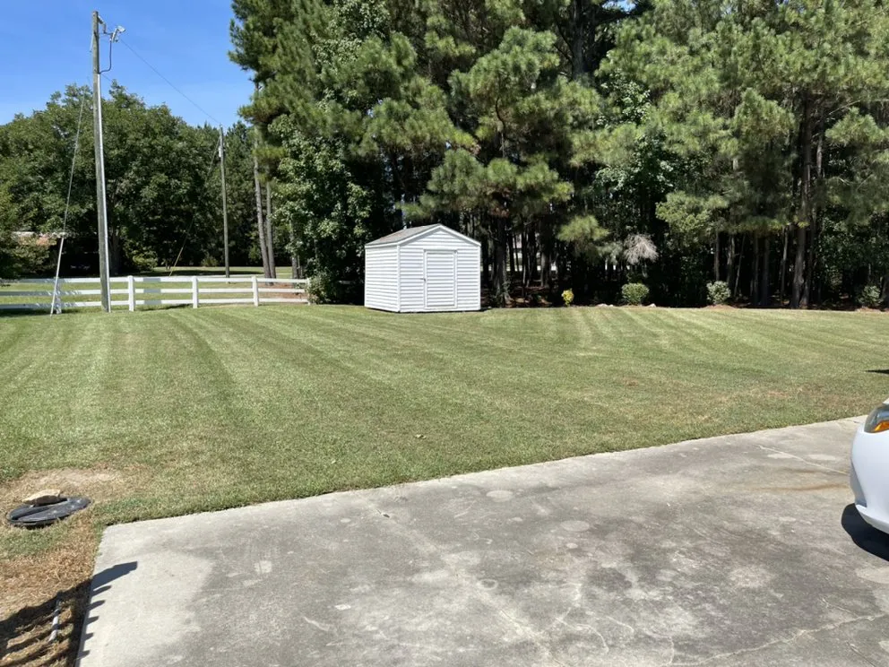 Custom garden landscaping for residential properties in Selma, NC by Rojas Pro Services