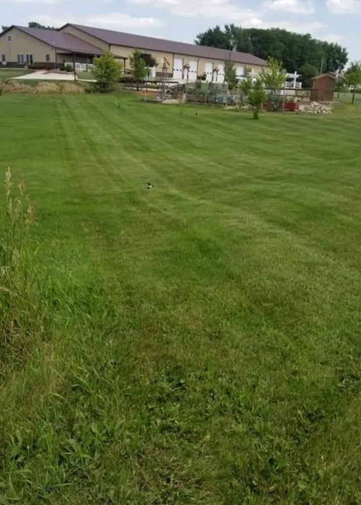 Custom residential landscaping for year-round maintenance in Eldora, IA by Roll and Sons Lawn Care