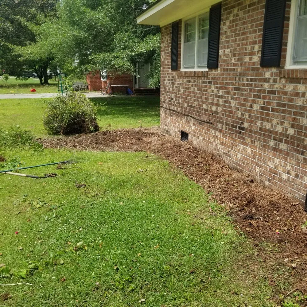 Expert lawn mowing service with custom design in Magnolia, NC by Roman’s Customized Lawn & Maintenance Care