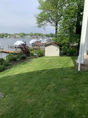 Romon’s Lawncare Logo