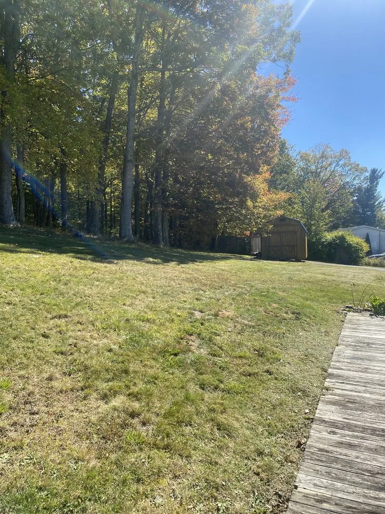 Custom landscape design with custom design in Scarbro, WV by Rooted In Christ Lawn Care