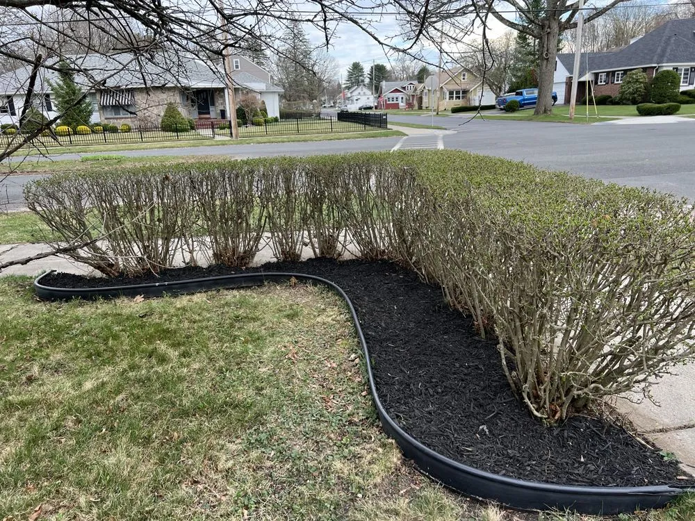 Top-rated landscape installation for residential properties in Gloversville, NY by Rooted Lawn Care