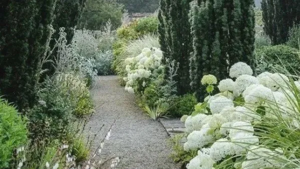 Custom garden landscaping in Oswego, IL by Rooted Outdoor Living