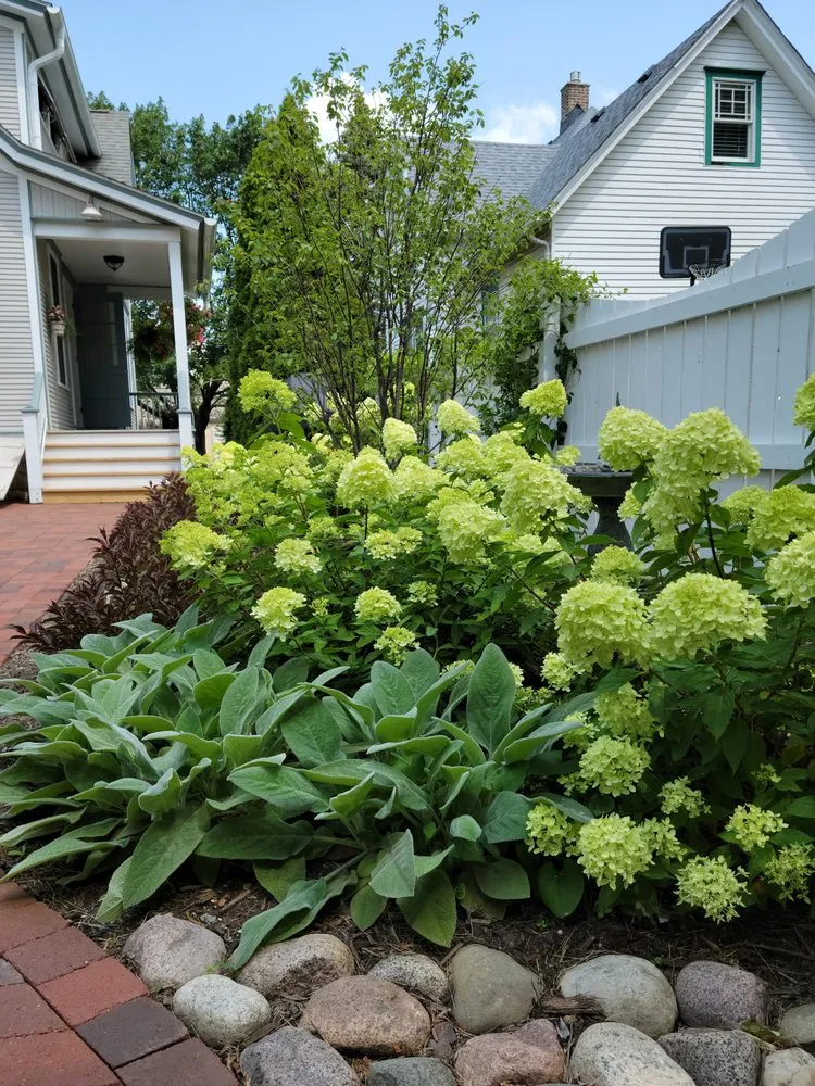 Reliable lawn mowing service for outdoor upgrades across Oswego, IL - Rooted Outdoor Living