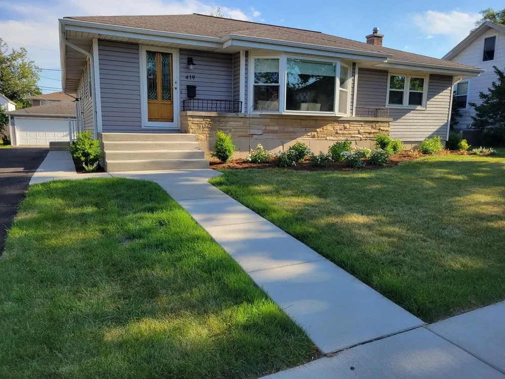 Custom lawn mowing service with custom design in Oswego, IL by Rooted Outdoor Living