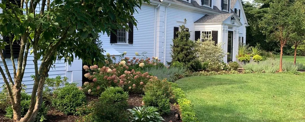 Custom lawn mowing service in Concord, MA - Roots & Rocks Landscape Artisans