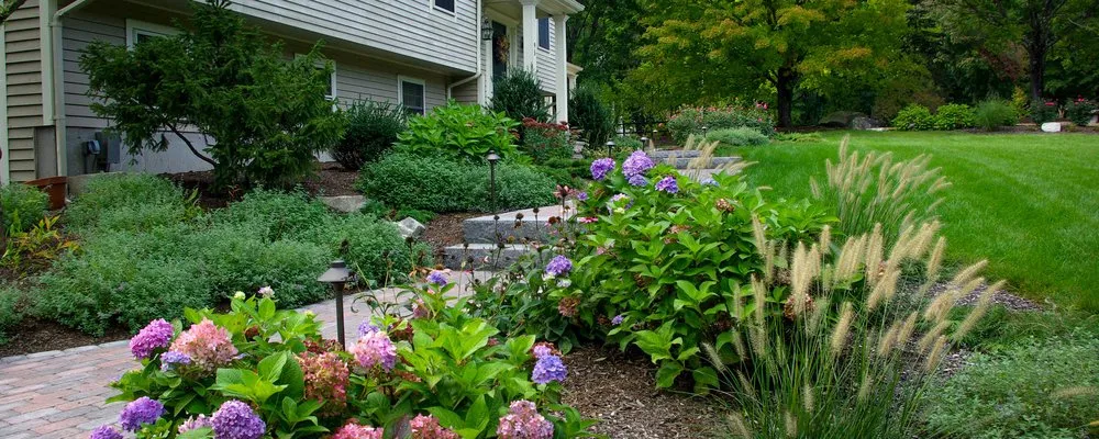 Professional landscape installation for homes in Concord, MA by Roots & Rocks Landscape Artisans