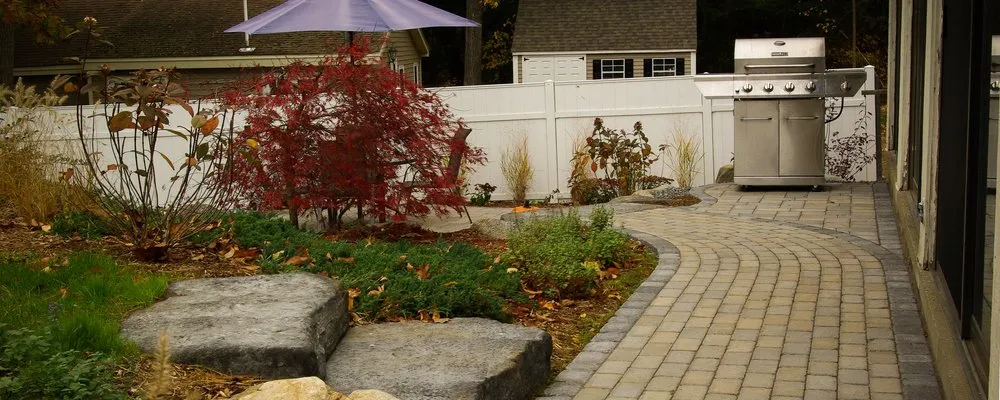 Expert yard cleanup service for residential properties across Concord, MA - Roots & Rocks Landscape Artisans