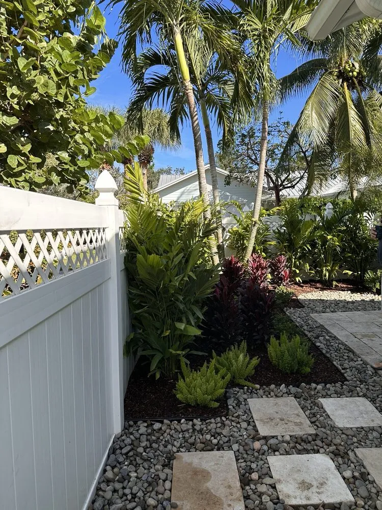 Custom lawn mowing service for homes in Palm Beach Gardens, FL by Roots Landscape Service