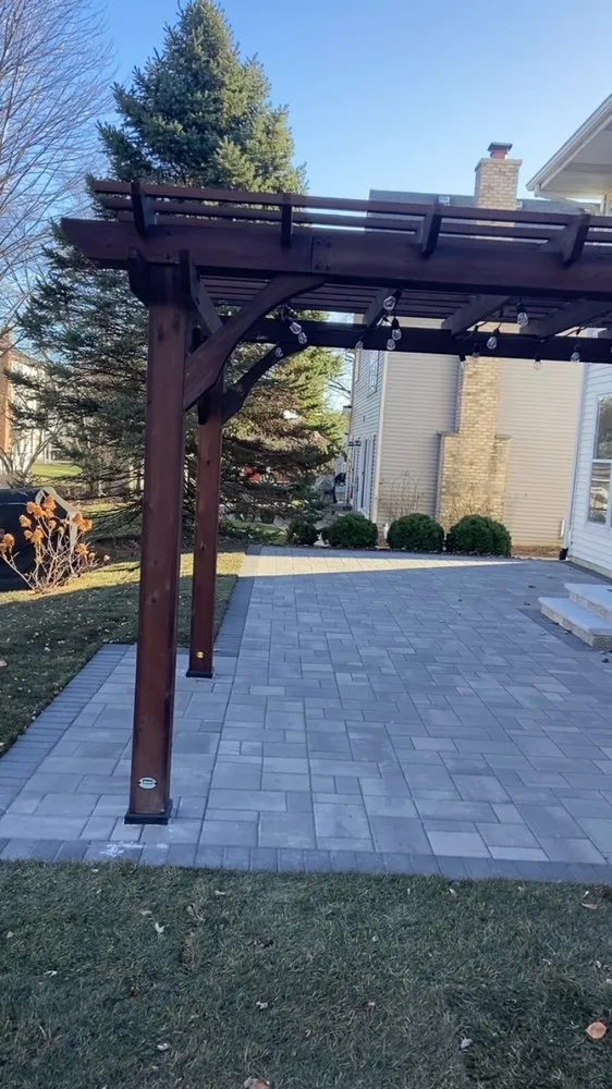 Custom landscape installation in Palatine, IL by Roots Lawn Care