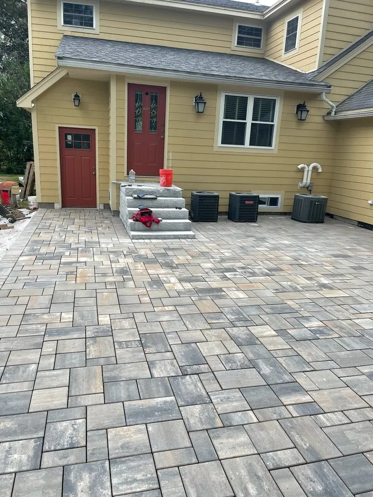 Custom landscape installation in Chelmsford, MA by Roots 'n Shoots