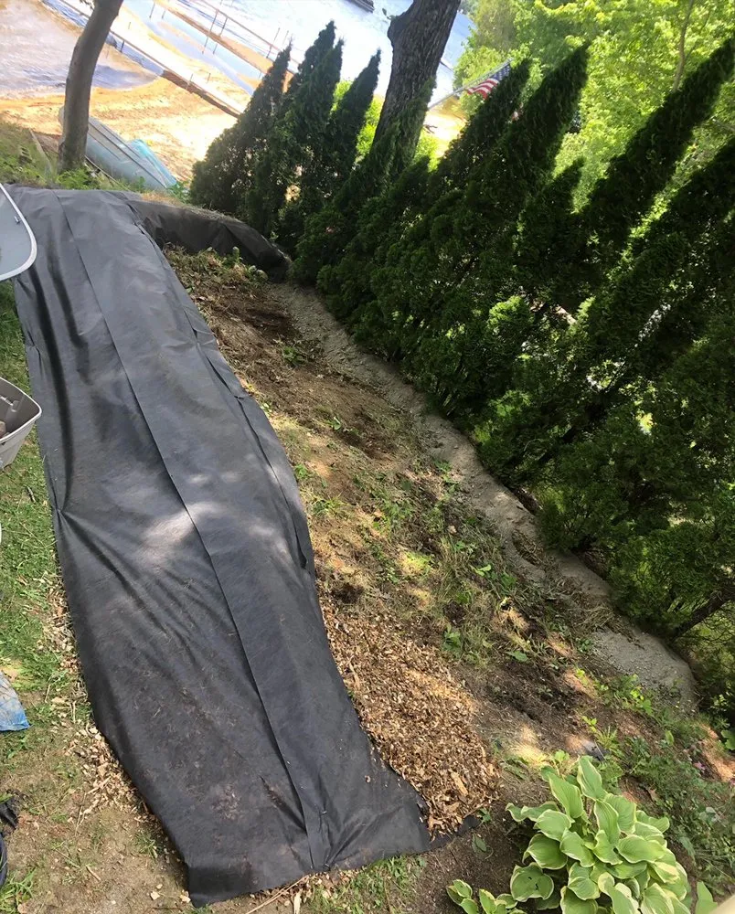 Expert landscape installation with custom design in Pownal, ME by Roots Of The Wild Sun