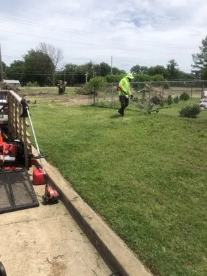 Rosa Mae’s Lawn Care Logo