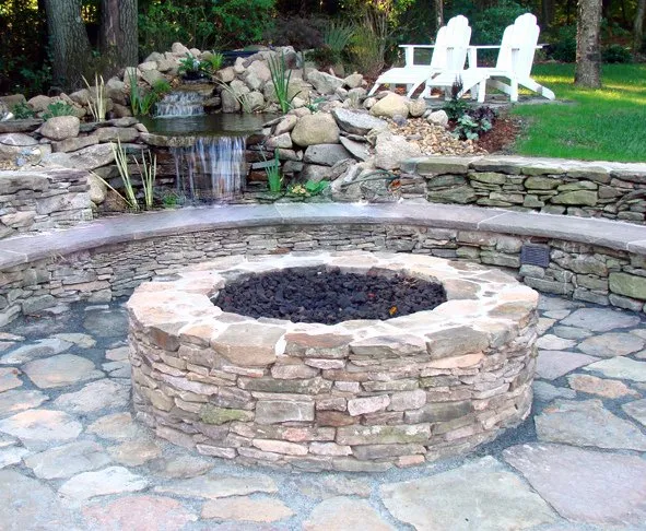 Custom landscape installation for residential properties in Westborough, MA by Rosado & Sons