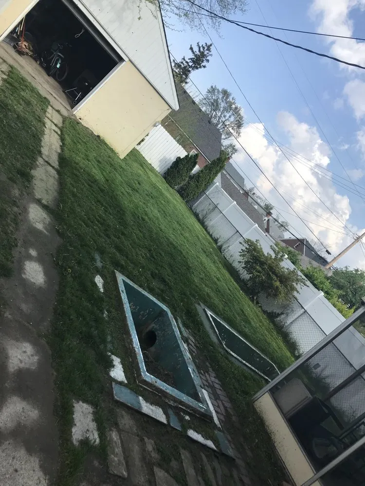 Custom landscape installation in Oak Park, MI by Rowe's Nurturing Estates