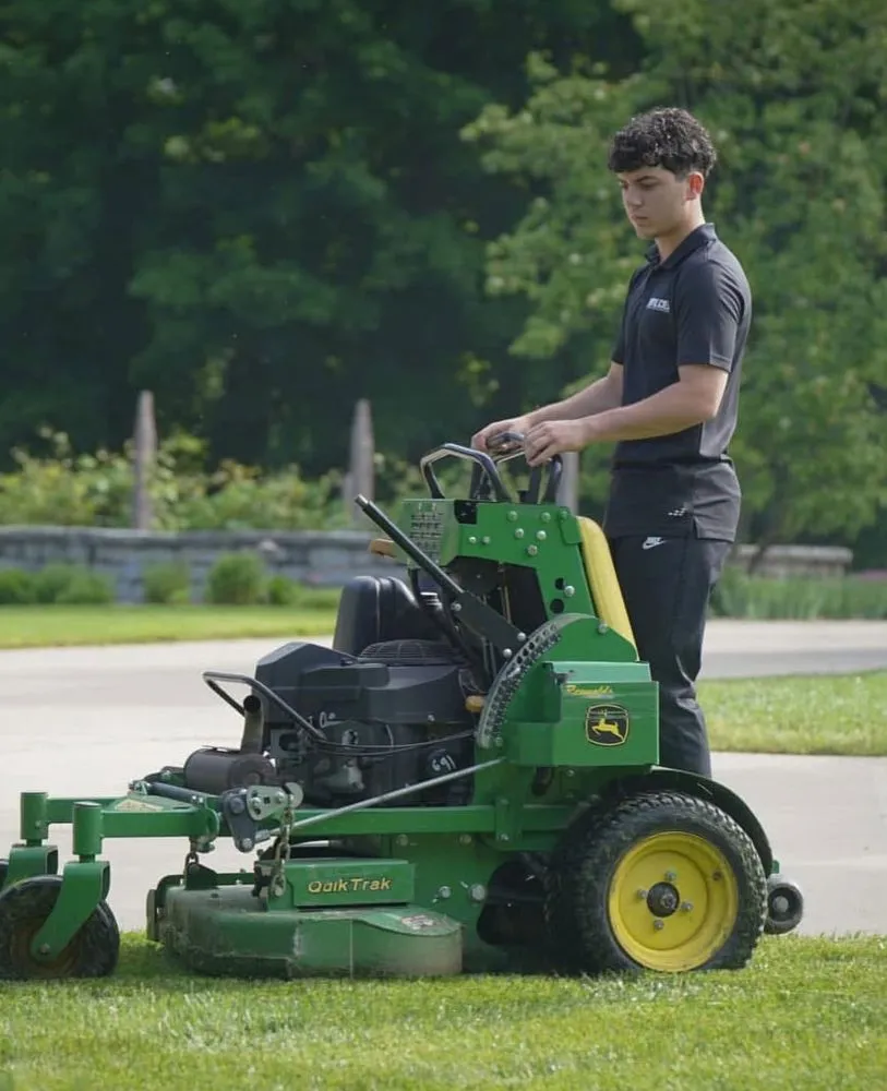 Custom landscape design for year-round maintenance in Terre Haute, IN by Royal Acres Services