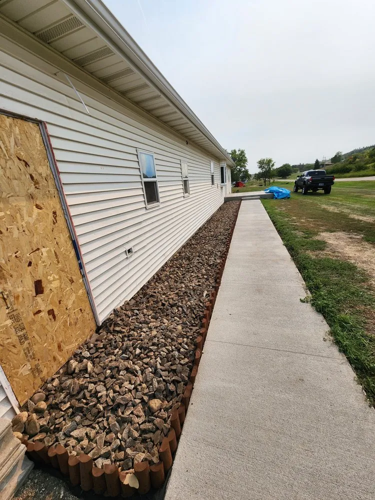 Affordable lawn care service for homes in Minot, ND by Ruachos Maintenance