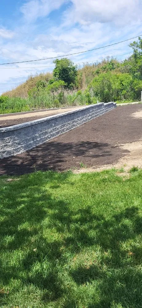 Custom landscape installation for outdoor upgrades in Calverton, NY by Rubio Cleaning & Landscaping