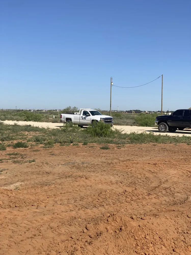 Professional landscape design for year-round maintenance in Odessa, TX by S L A M Septic Services