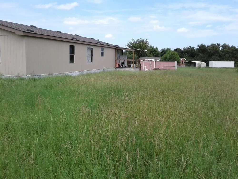 Custom outdoor landscaping in Haltom, TX by Sambrano's Lawn Service
