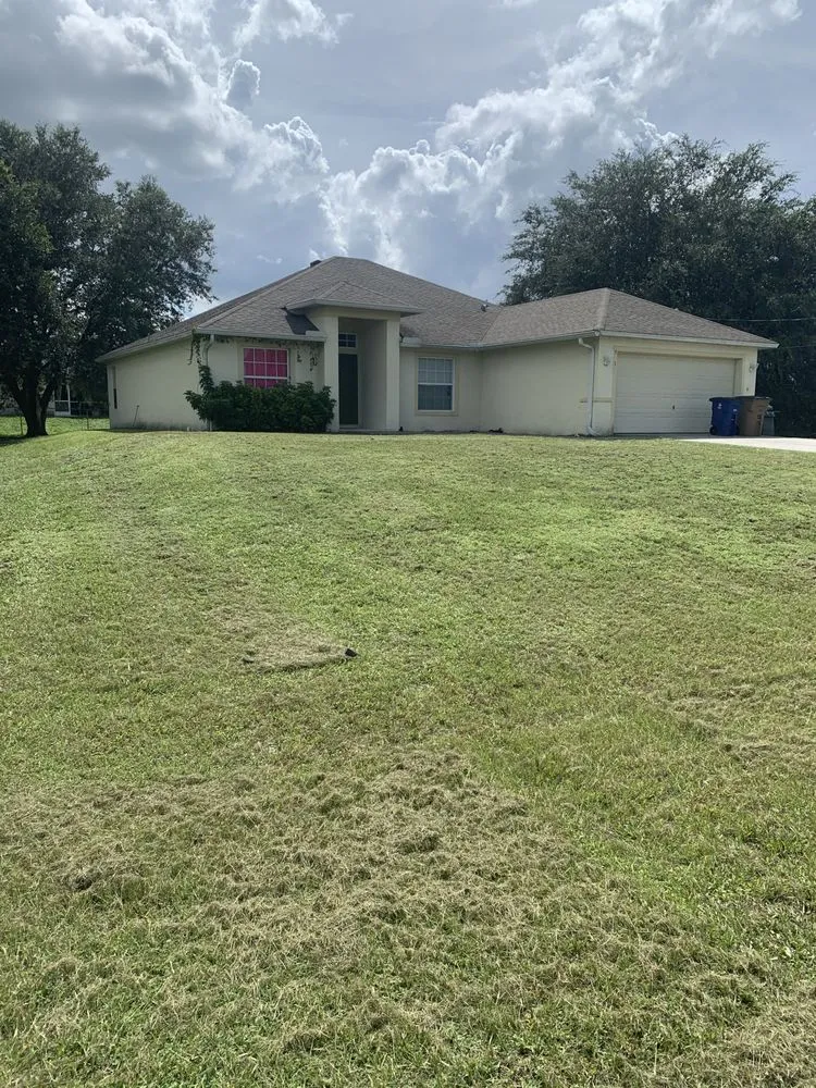 Professional yard cleanup service in Lehigh Acres, FL by Sam’s Lawn Service