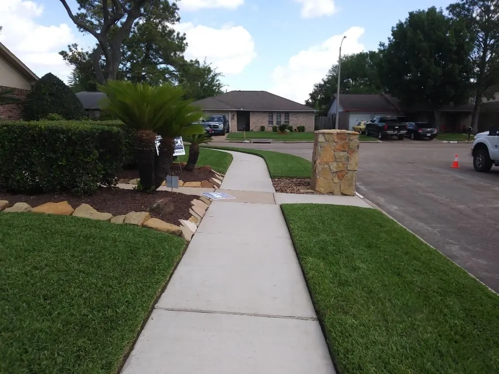 Custom garden landscaping for residential properties in Houston, TX by Santiago and Son's Lawn Care
