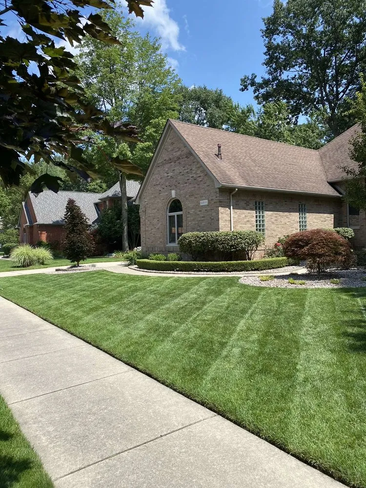 Professional lawn mowing service for year-round maintenance in Sterling Heights, MI by Santis Property Maintenance