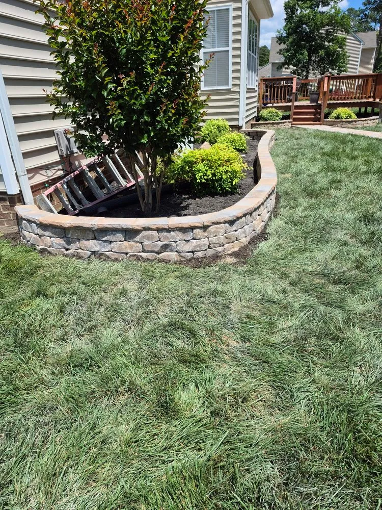 Custom lawn mowing service for outdoor upgrades in Richmond, VA by Santos Design and Services