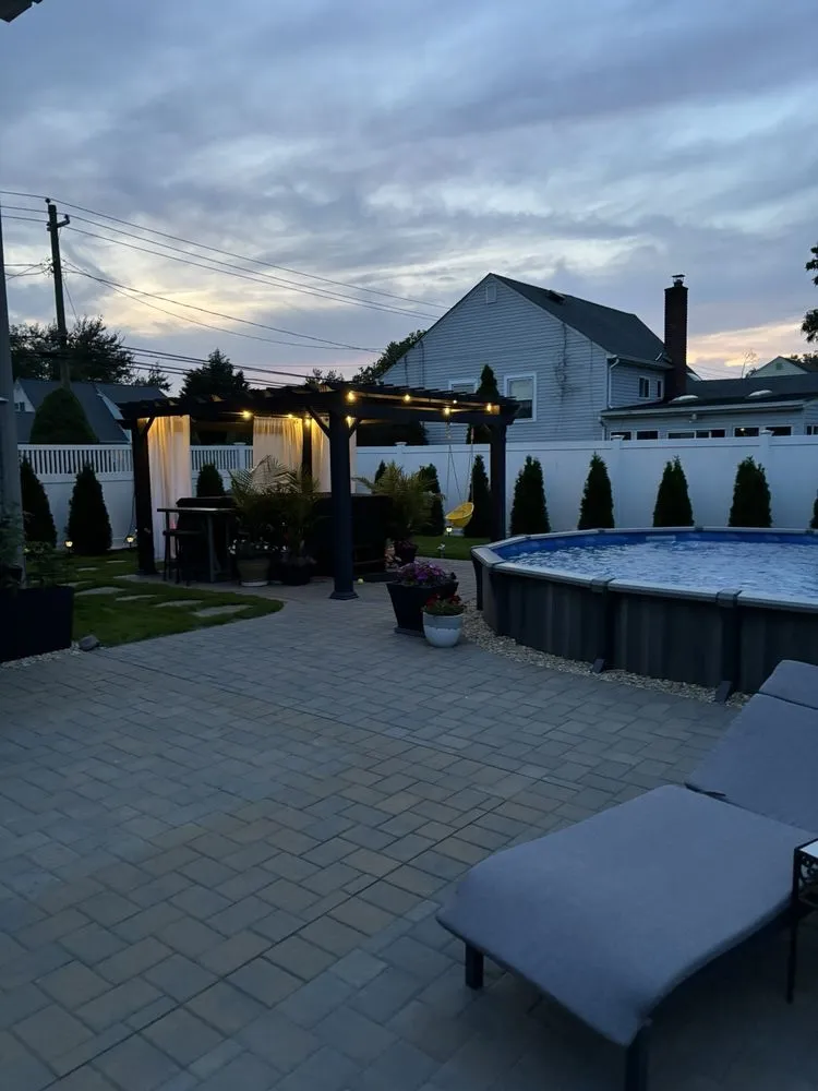 Custom landscape installation for beautiful yards in West Babylon, NY by Scanapico Bros Landscaping