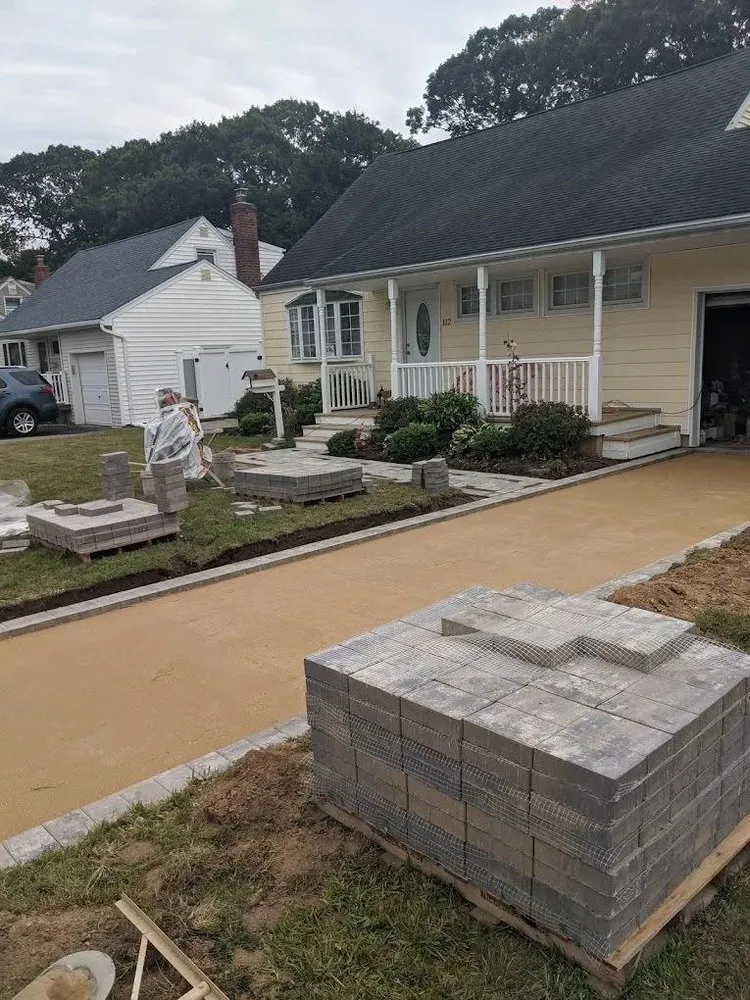 Professional garden landscaping for year-round maintenance in West Babylon, NY by Scanapicos Landscaping & Masonry