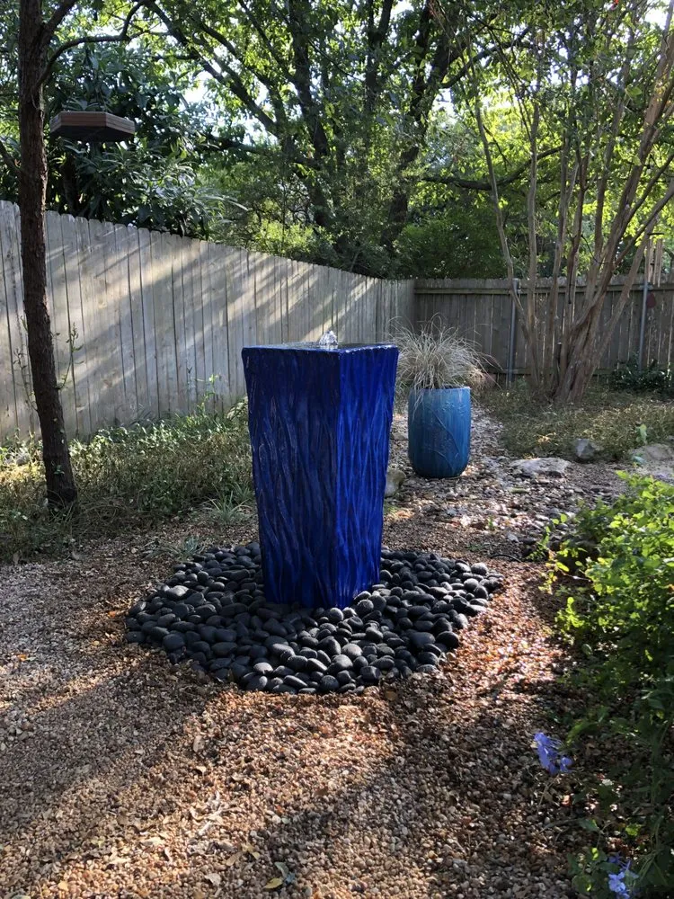 Custom outdoor landscaping with custom design in San Antonio, TX by Scapes Creative Outdoor Solutions