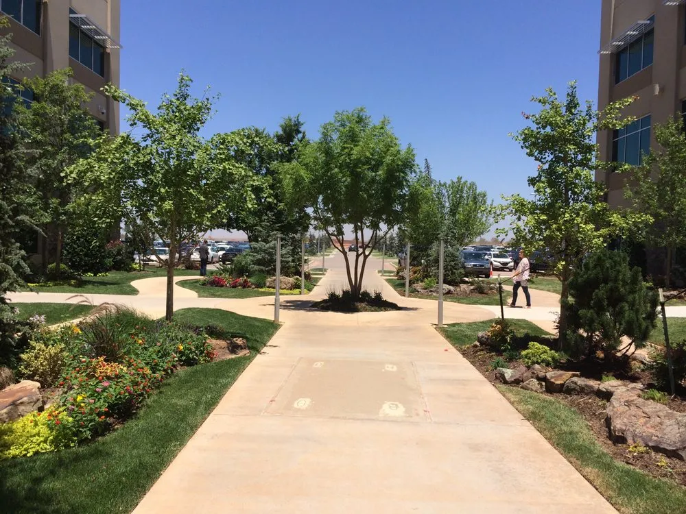 Expert yard maintenance in Mustang, OK by Scapes