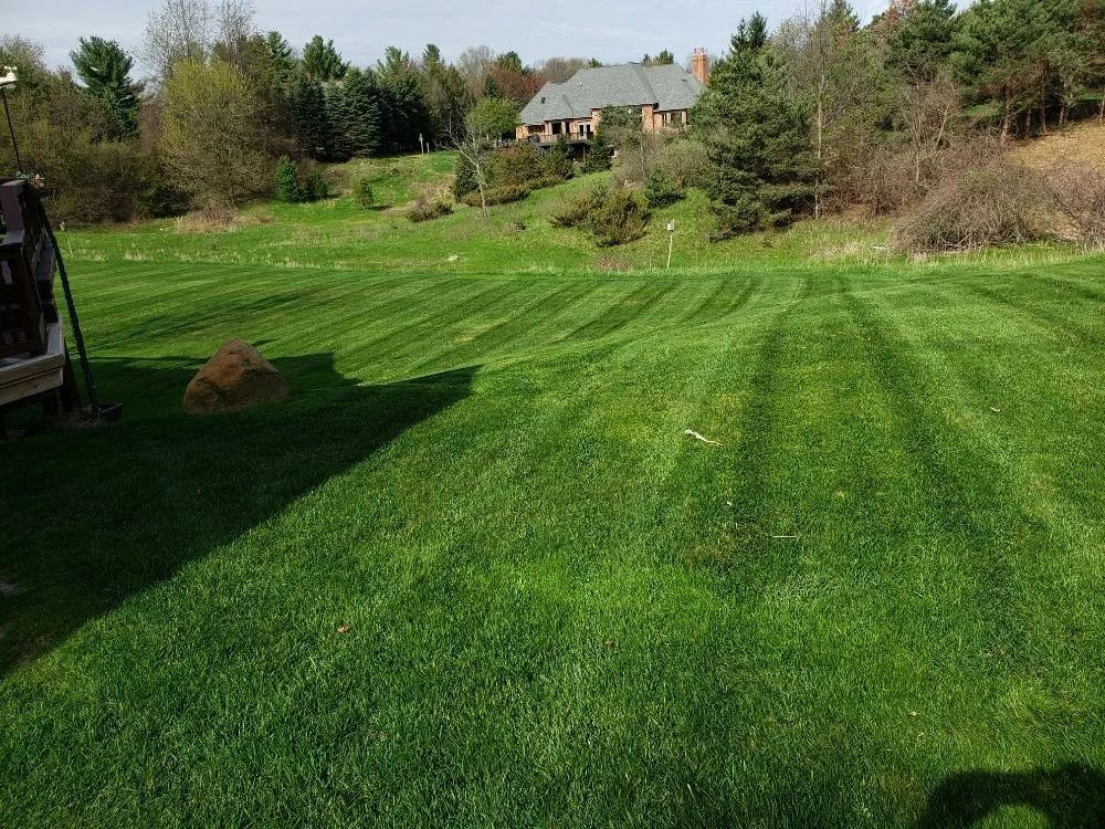 Professional yard maintenance for residential properties in Orion charter Township, MI by Scheerah's Landscaping