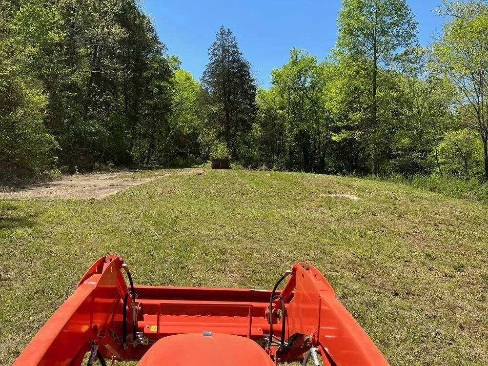 Professional landscape design with custom design in Spring Hill, TN by Schemey's Got a Tractor