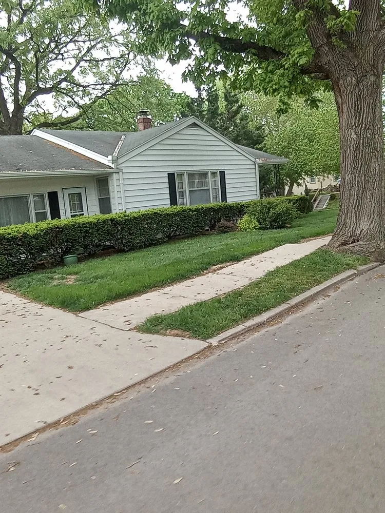 Professional yard cleanup service with custom design in Saint Joseph, MO by Schroff's Family Lawn Service
